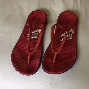 Well worn Nike flip flops